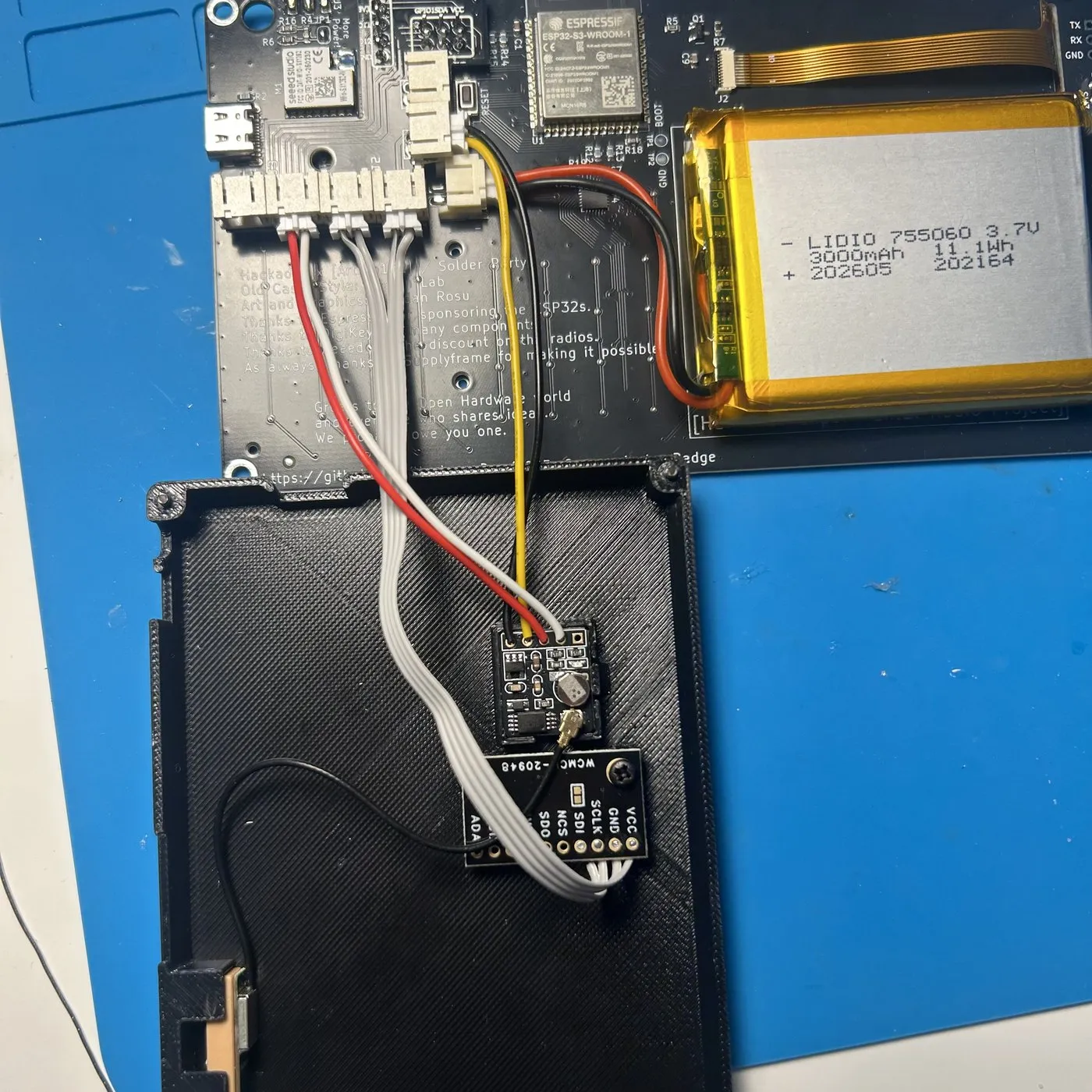 An ICM-20948 breakout next to a GPS module in the printed case, its pin header labelled VCC, GND, SCLK, SDI, NCS and SDO.